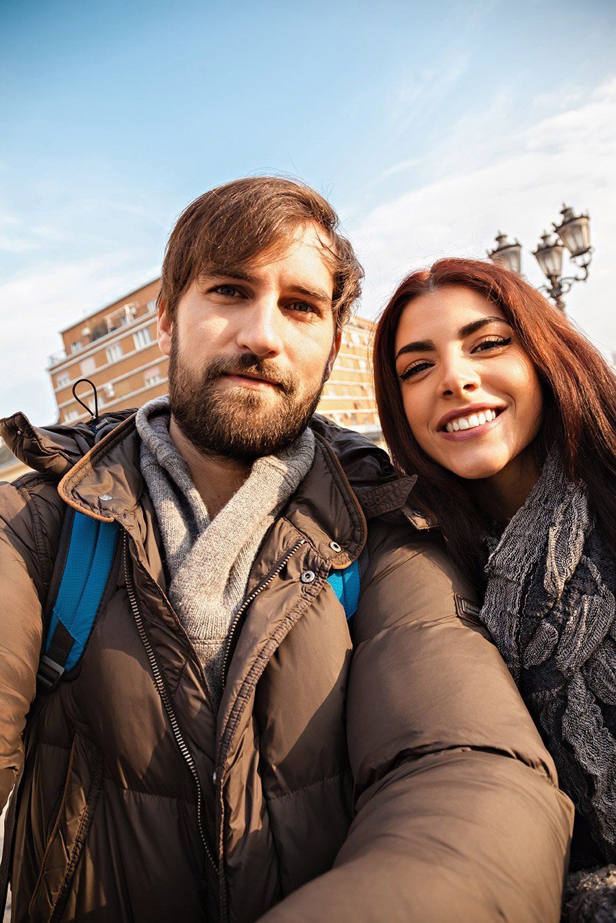 Couple taking a selfie outdoors representing relationship and infidelity investigation services