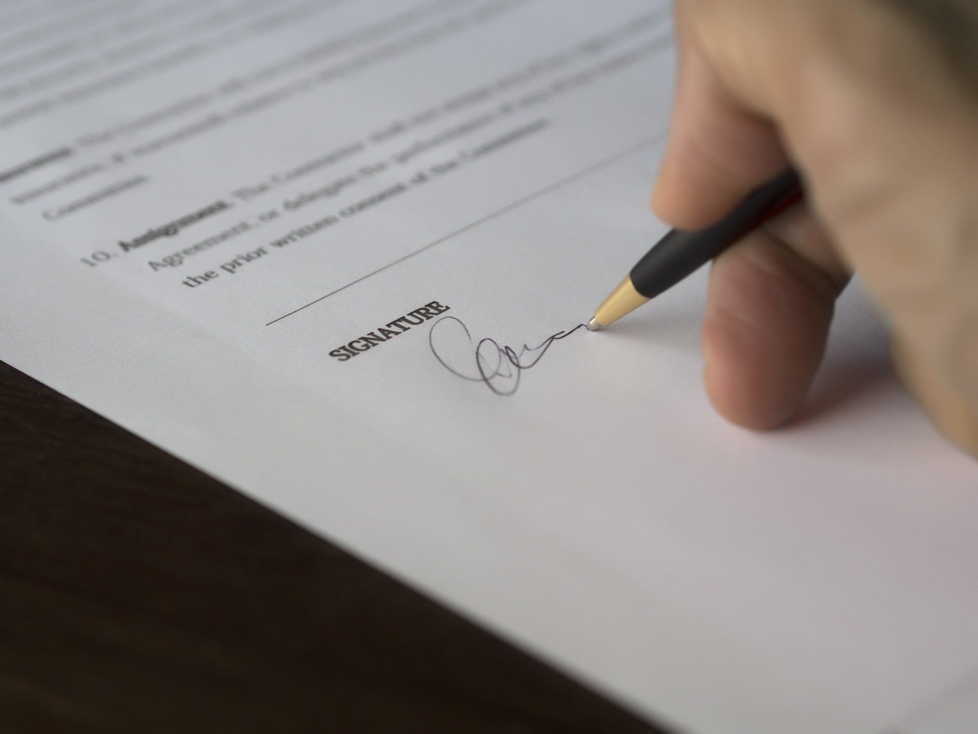 Person signing a legal document representing official records, affidavits, or investigative documentation